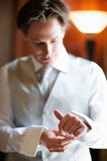 the groom getting ready for his big day