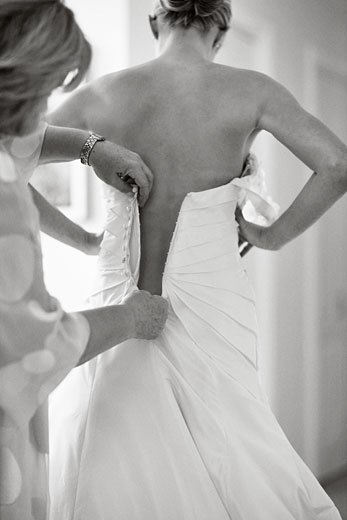 the bride getting ready for her big day, getting in to the dress