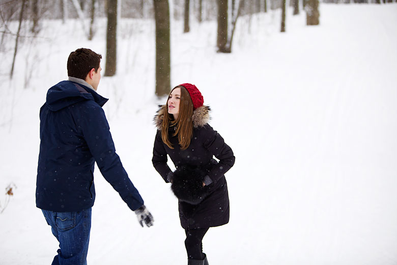 playing with a snow, engagement photo-shoot in Montreal