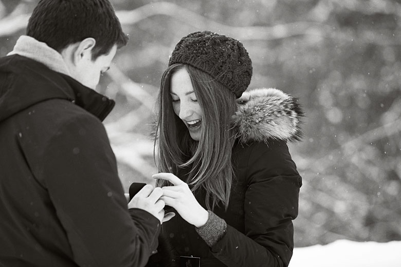 a happy couple, engagement ring