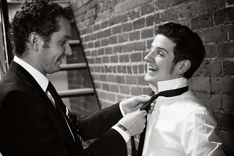 best man helps the groom to get ready for the wedding