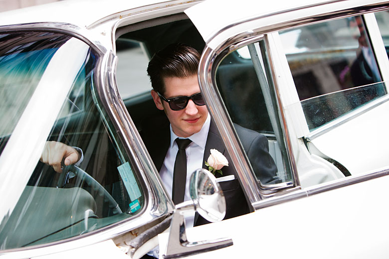 getting in to the old car in old Montreal, groom photo