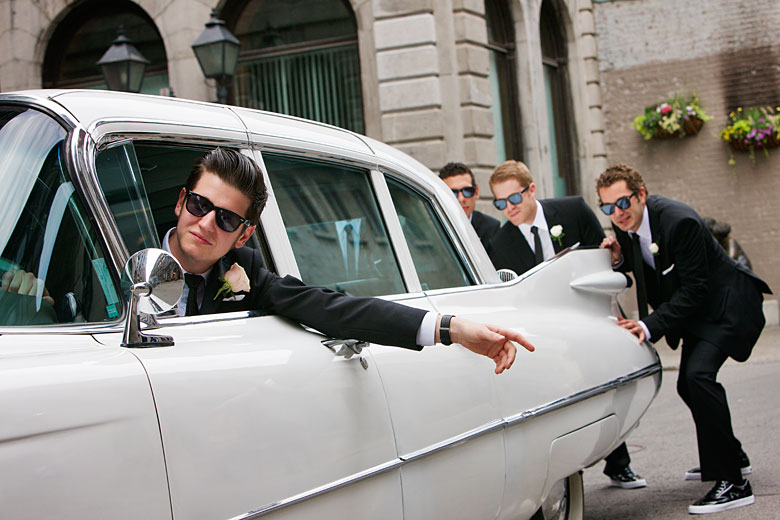 pushing the old wedding car on the streets of old port Montreal