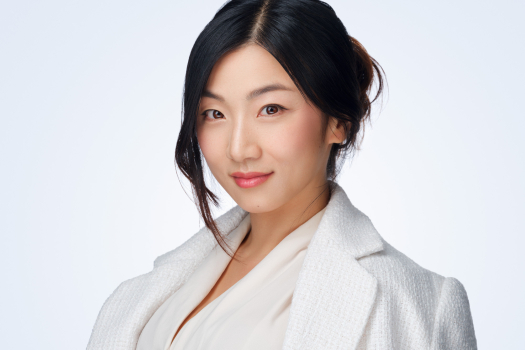 Professional corporate headshot of an Asian businesswoman photographed in studio by Montreal photographer Vadim Daniel