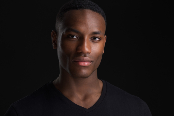 Professional modeling portfolio headshot of a Black man photographed by Montreal photographer Vadim Daniel