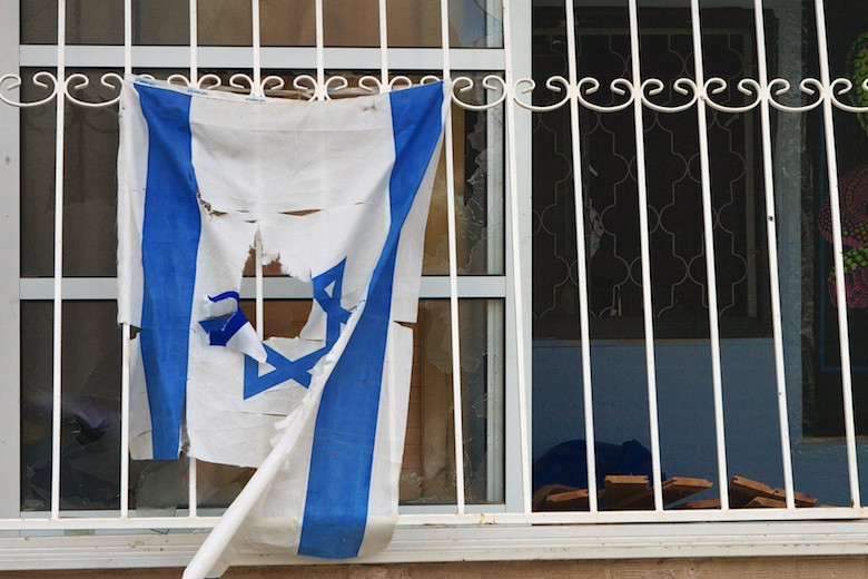 Israeli flag after rocket attack in north Israel